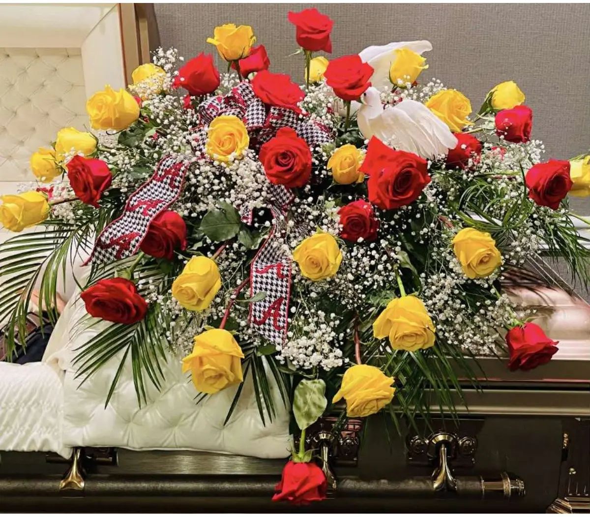 Baby's red and yellow casket spray