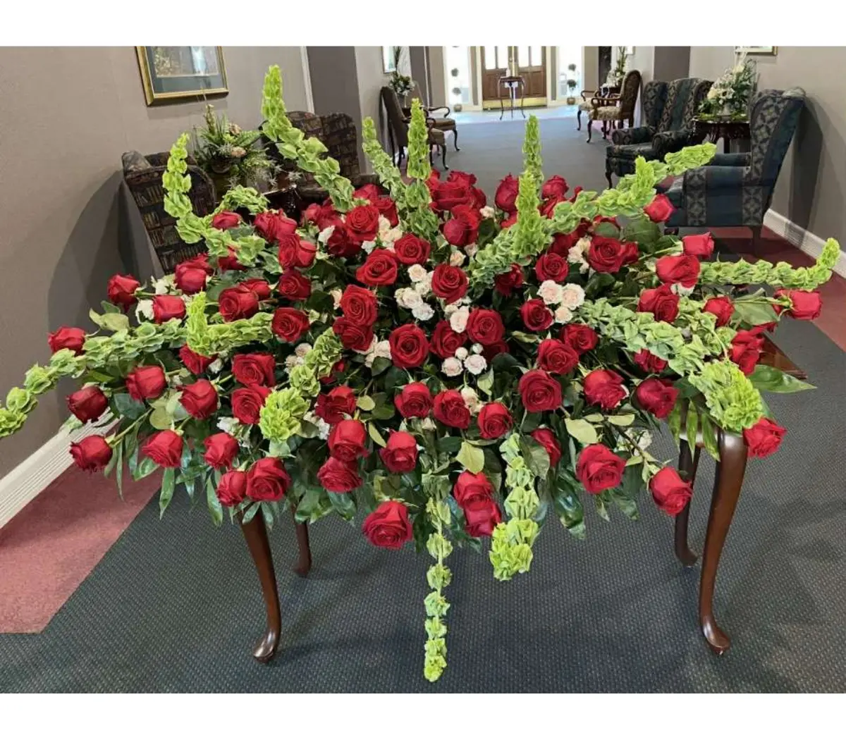 Roses and Baby's Breath Casket Spray Roses and Baby's Breath Casket Spray