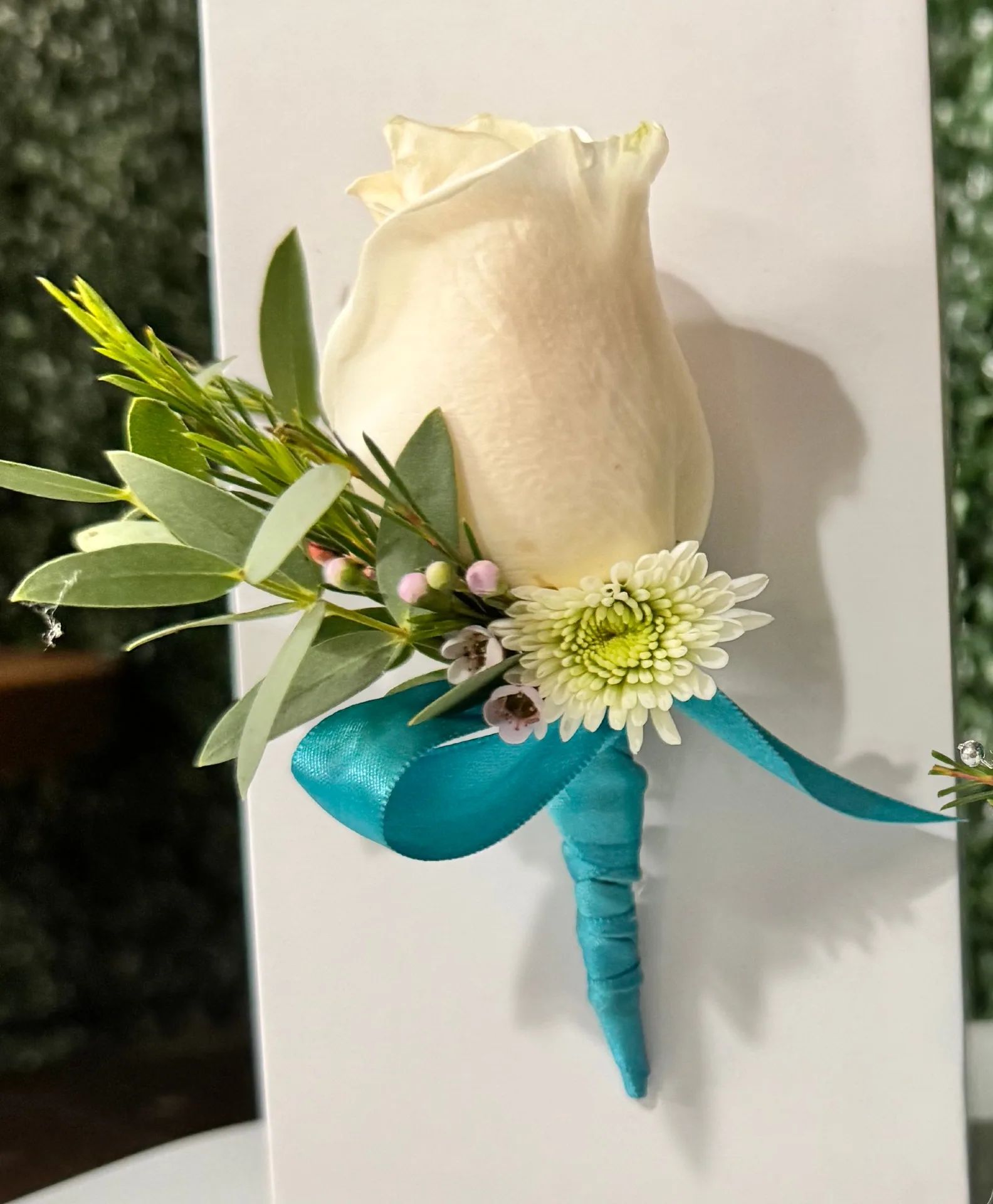 agua blue boutonniere