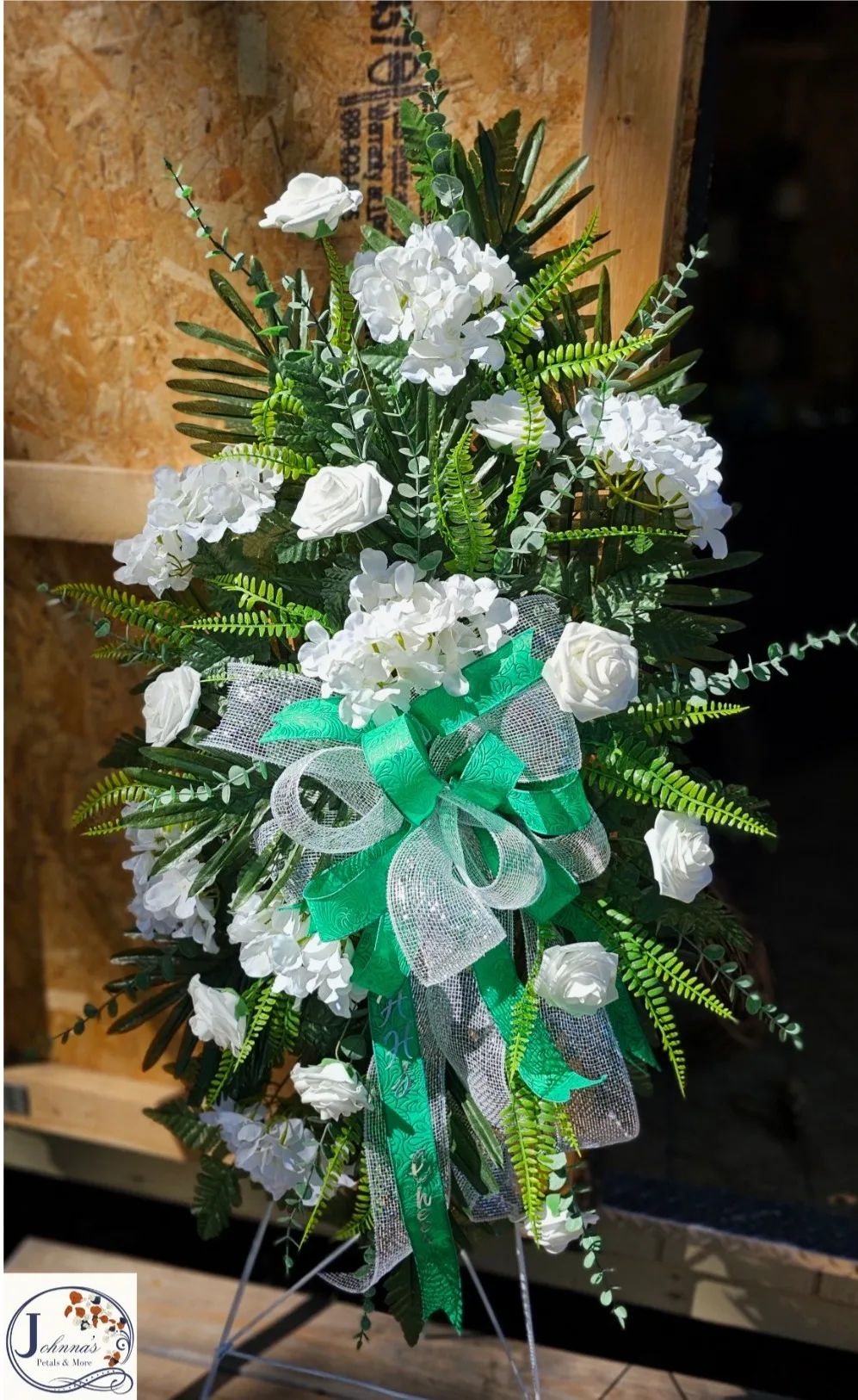 Silk white and green themed spray on easel