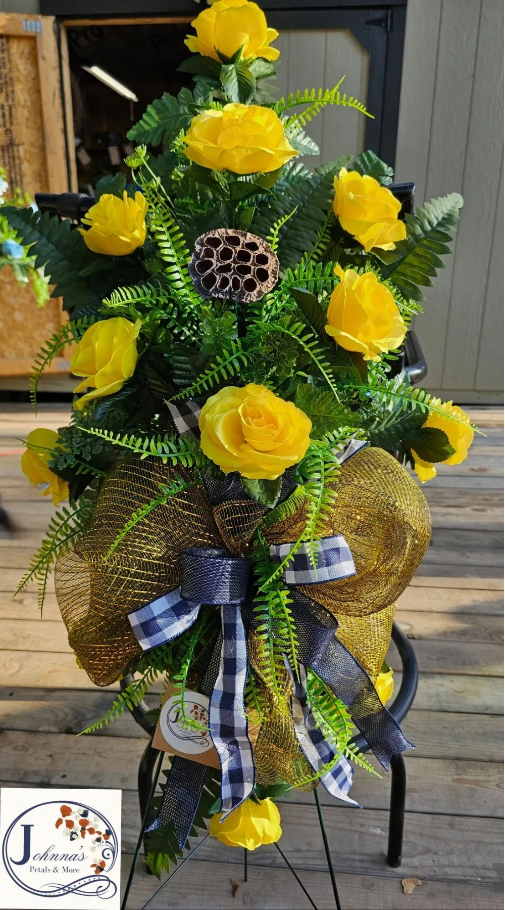 Silk Yellow Rose spray with blue accents on easel