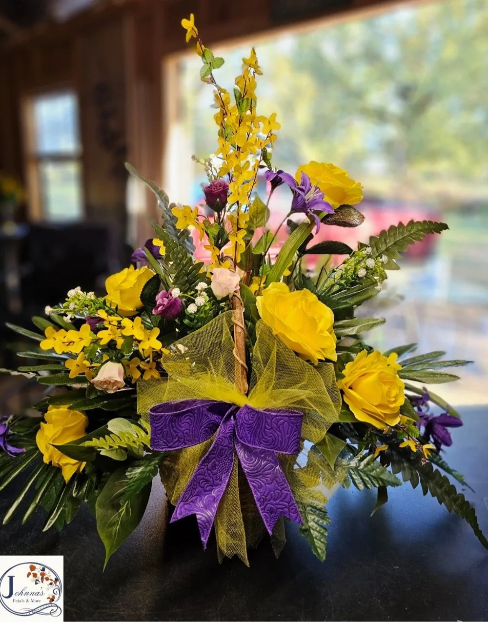 Silk basket arrangement of purples and yellows