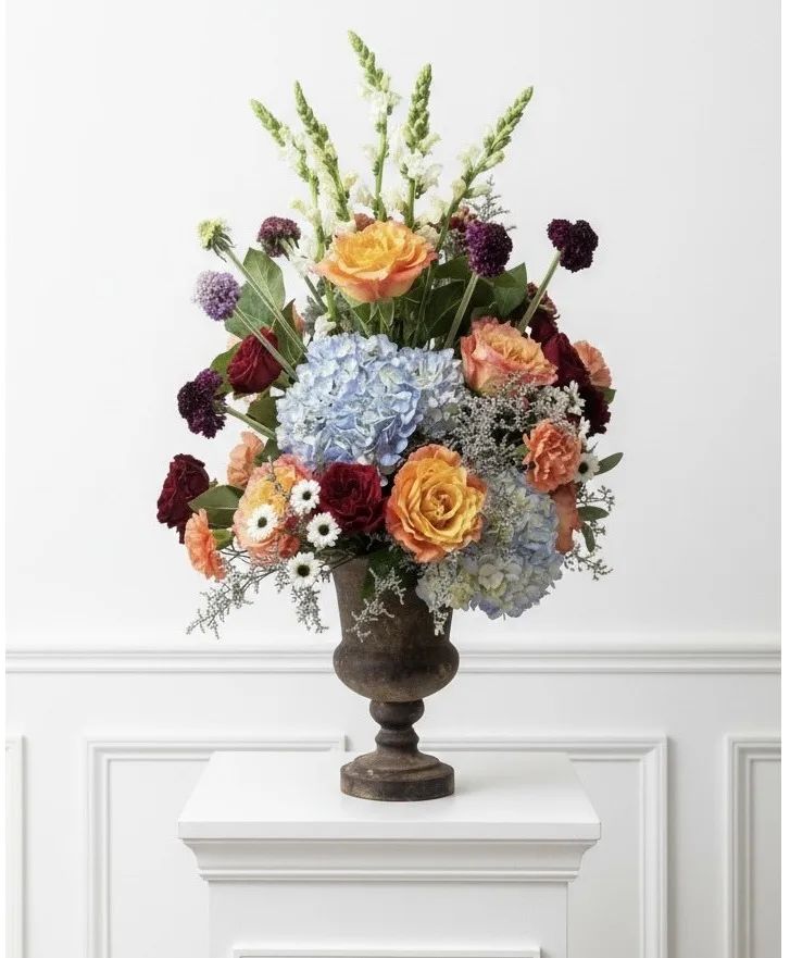 Rustic Beauty Footed Vase large rustic vase brimming w/ roses, hydrangea, snapdragon
